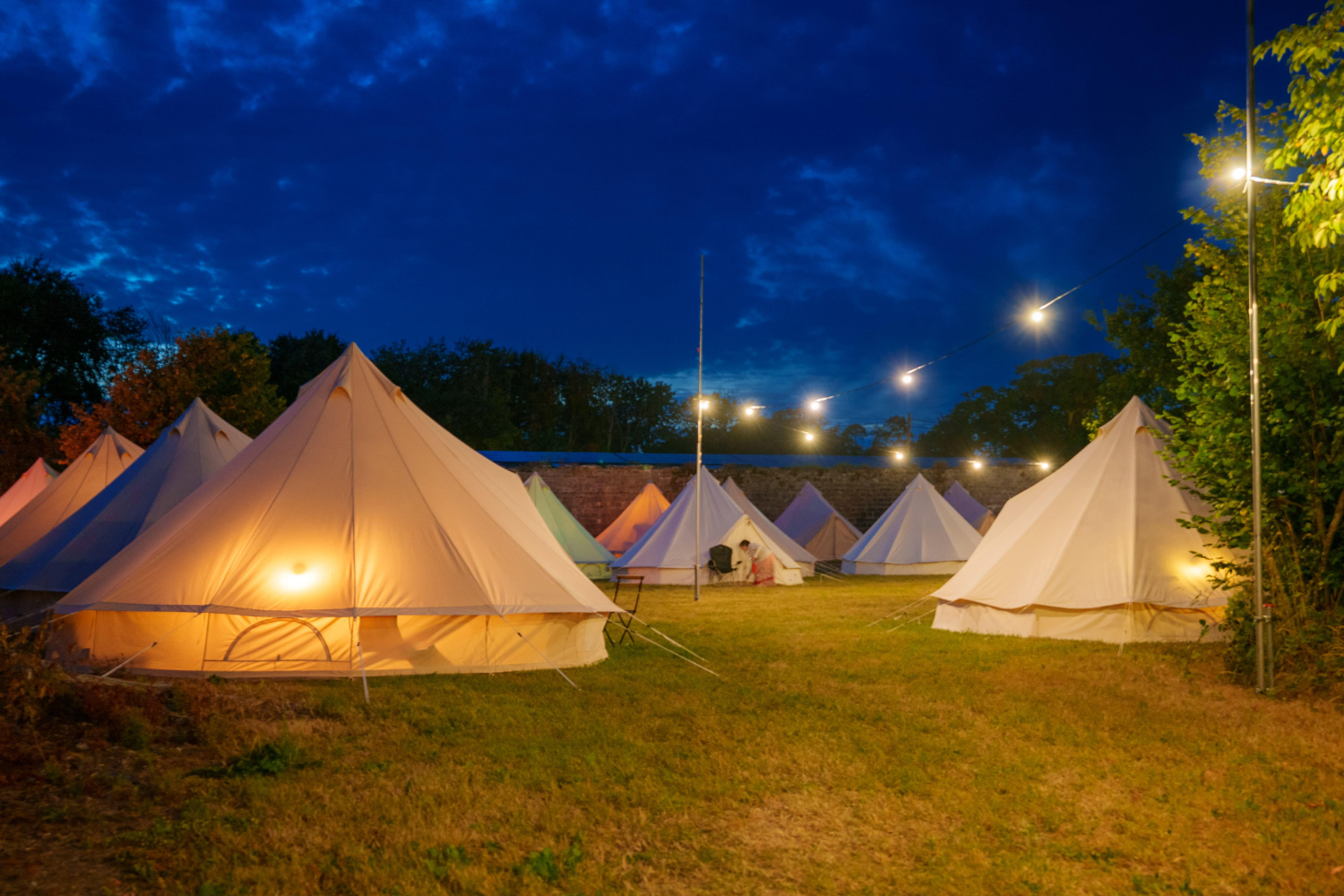 boutique glamping site at night